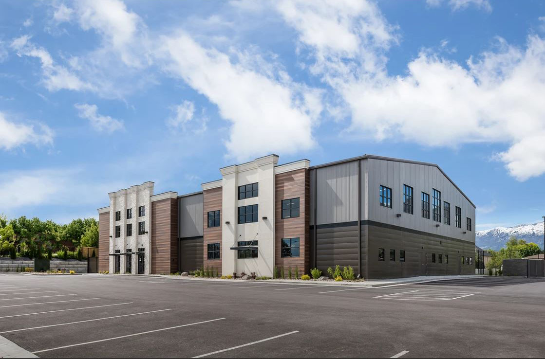 Large steel building with stone and metal exterior